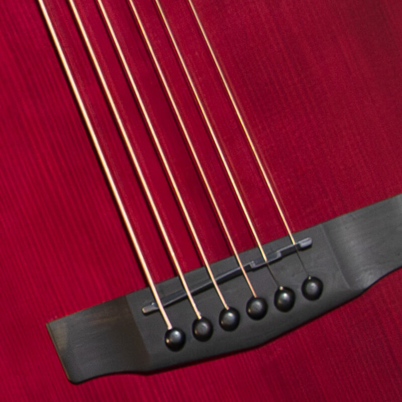 Cort Modern Burst guitar string and saddle closeup