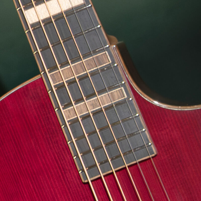 Detailed close-up of the Cort Modern Burst guitar showcasing the fretboard and body